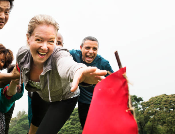 istock People racing to catch a flag 1014852170