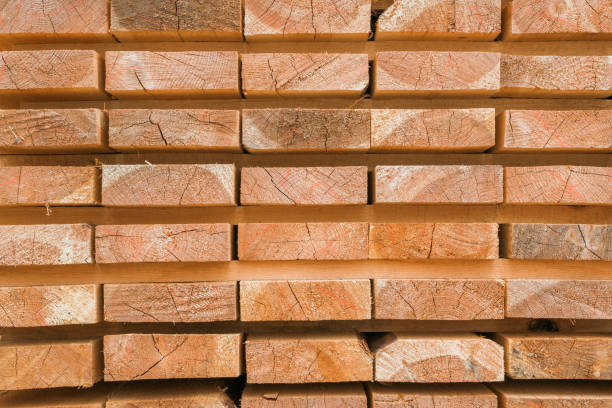 istock Wooden planks to build a house on a stack of folded construction base 1014852430