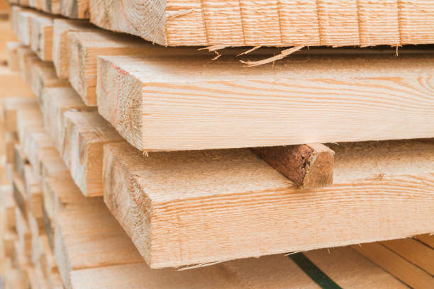 istock Wooden planks to build a house on a stack of folded construction base 1014852504
