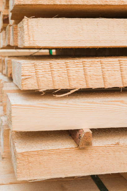 istock Wooden planks to build a house on a stack of folded construction base 1014852506