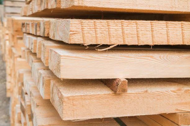 istock Wooden planks to build a house on a stack of folded construction base 1014852508
