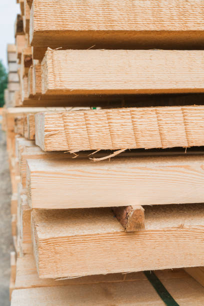istock Wooden planks to build a house on a stack of folded construction base 1014852544