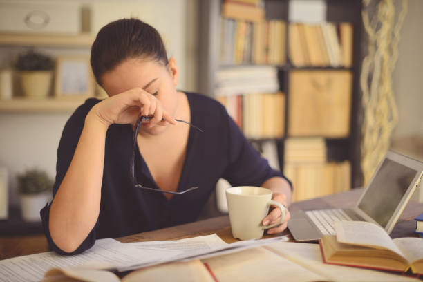 young woman working at home( headache) - teenager teenagers only one teenage girl only human face imagens e fotografias de stock