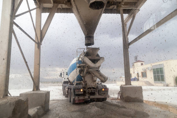 Cement plant and cement mixer trucks. Cement Mixer waiting  and parking on line.