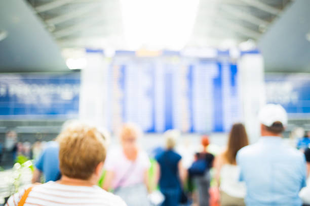 istock Blurred people in airport. 1014876284