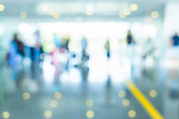 istock Blurred people in airport. 1014876302
