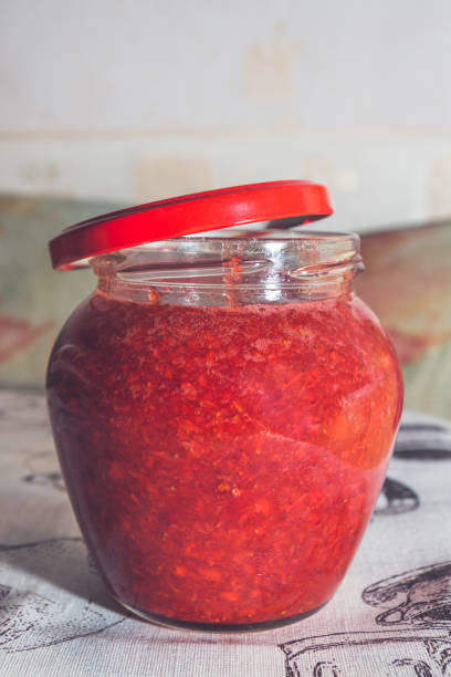 istock Fresh strawberry jam in a glass jar 1014876528