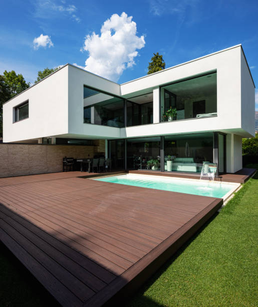 istock Exterior modern white villa with pool and garden 1014883926