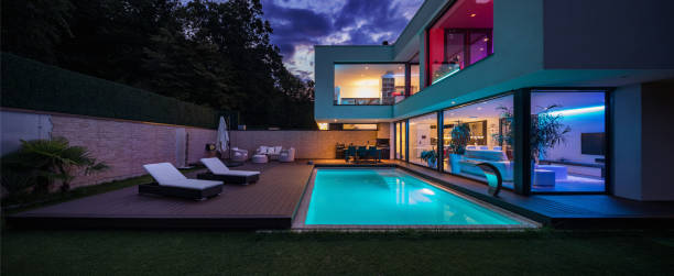 Modern villa with colored led lights at night stock photo