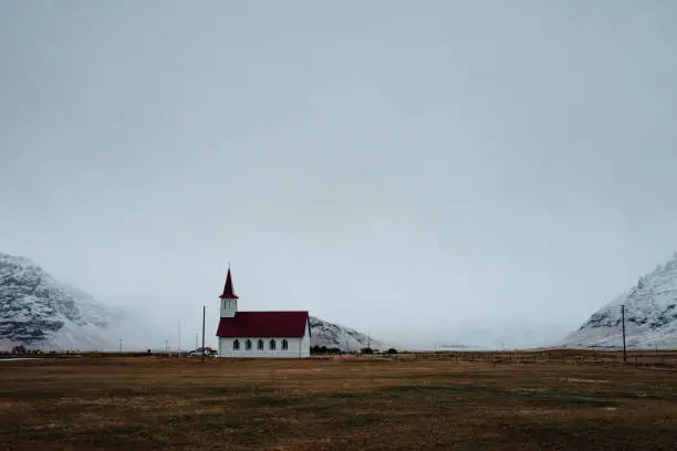 A church in Iceland in front of some mountains
