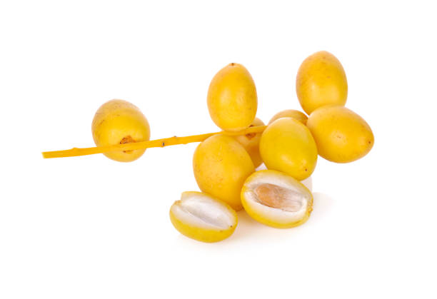 istock bunch of fresh yellow dates on white background 1014891652