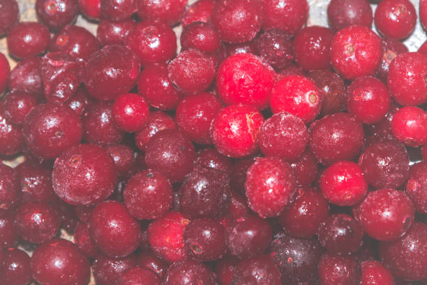 istock Cold frozen red berry cranberries on the table 1014892422