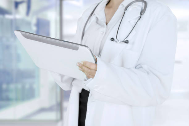 istock Female physician holding a tablet in the clinic 1014898184
