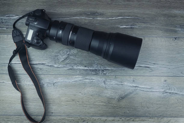 istock camera on a wooden background 1014927988