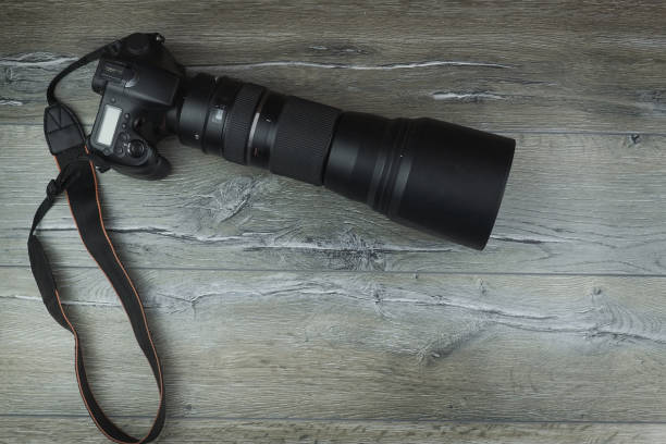 istock camera on a wooden background 1014928226