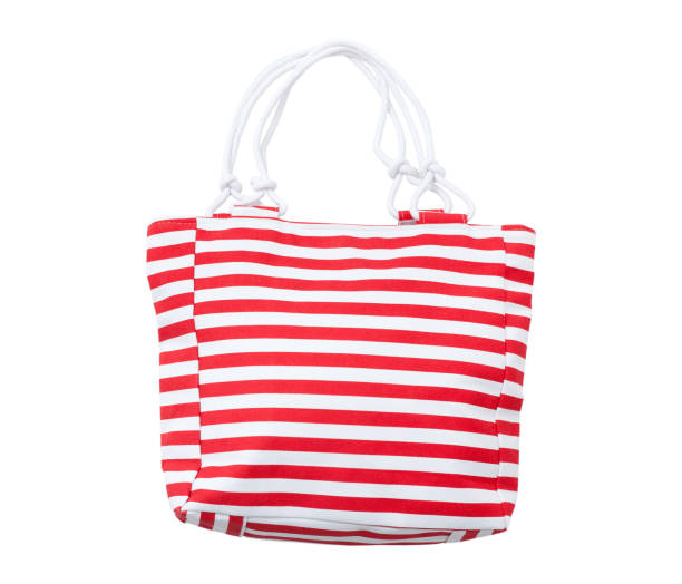 istock Summer accessories summer bag iwith a red stripe solated on white background. 1014931172