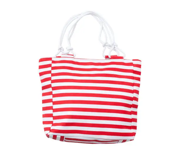 Summer accessories summer bag iwith a red stripe solated on white background. Mock up.