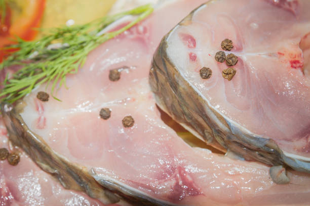 istock Raw fresh fish carp steaks with spices before cooking 1014933422