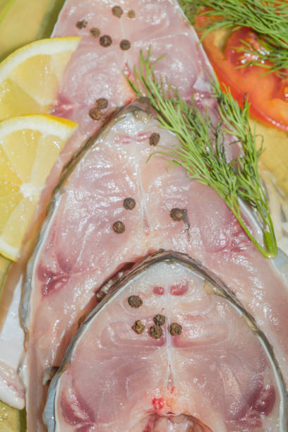 istock Raw fresh fish carp steaks with spices before cooking 1014933508
