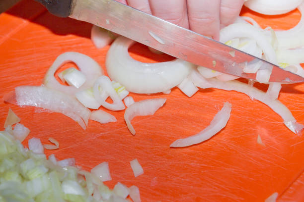 istock Chopped onion rings lies on the Board 1014934164