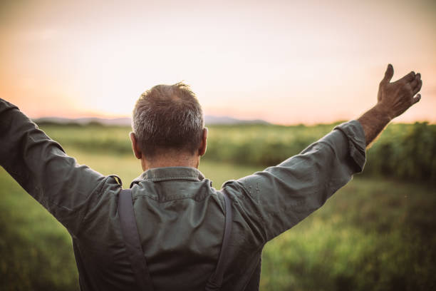 istock Farmer in field . Freedom 1014939436
