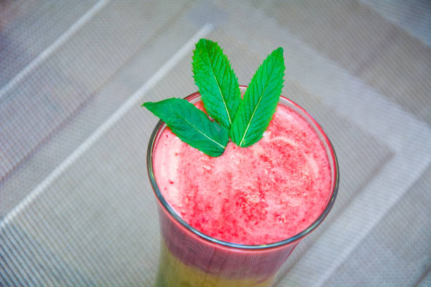 multicolored smoothies decorated with mint