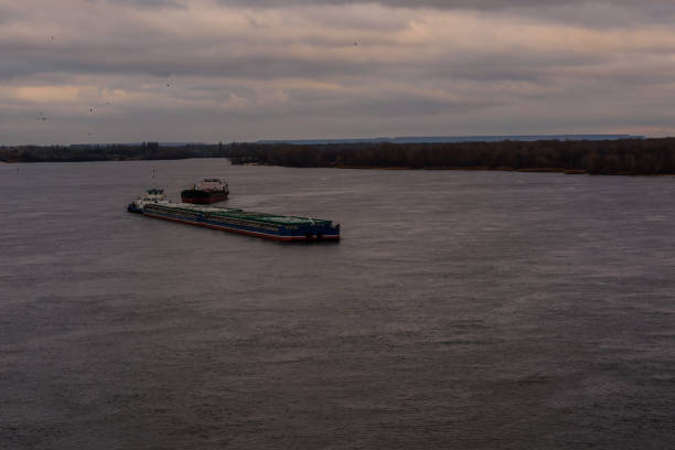 istock Big barge and ship on river Dnieper 1014943358