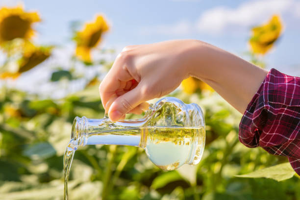 istock Vegetable oil from a glass bottle . 1014950262
