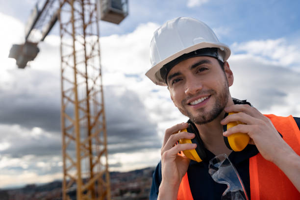 istock Portrait of a happy construction worker at a building site 1014950806
