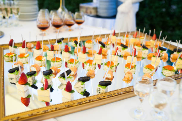 istock Delicious snacks on wedding reception table in luxury outdoor restaurant 1014961302