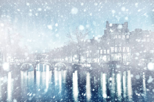 istock View of Amsterdam by night with snow 1014973816