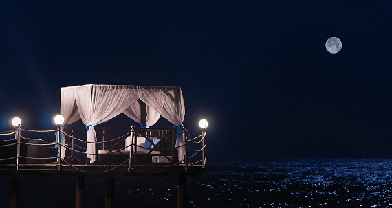 Five stars luxury hotel's pavilion by the sea at night