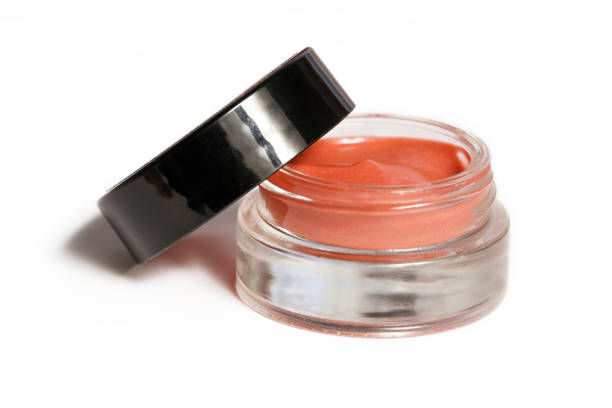istock Creamy make up product in a glass jar, isolated on white 1014979378