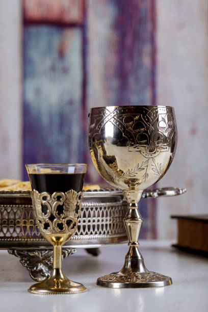 istock Wine for Passover with metal tray and matzo on table 1014987318