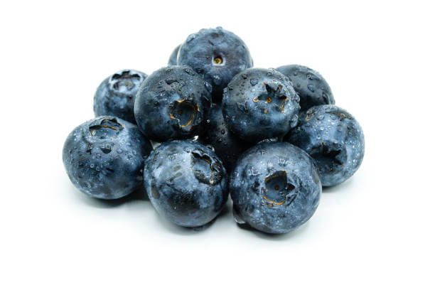 istock A pile of blueberries with water drops isolated on white background 1014987548