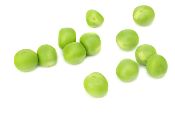 istock fresh green peas isolated on white background. top view 1014988006