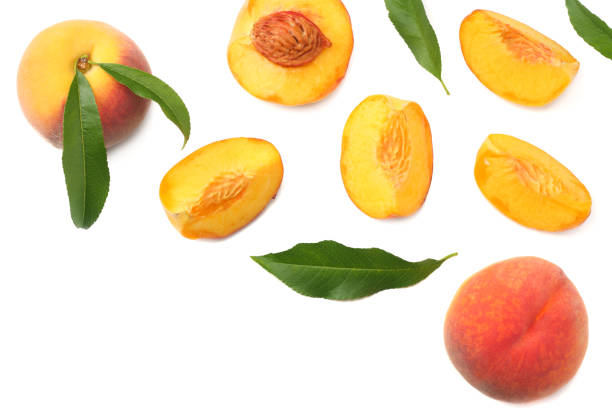 istock peach fruit with green leaf and slices isolated on white background. top view 1014988238