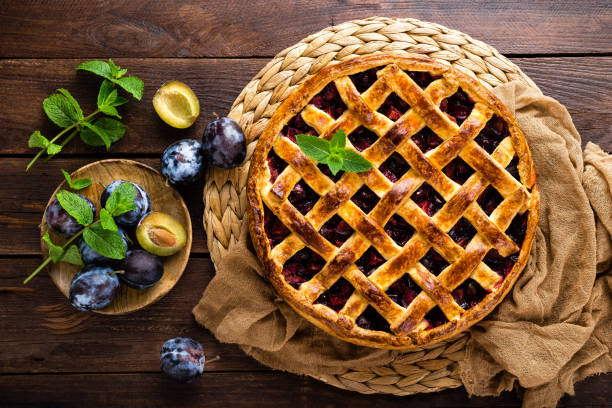 istock Fruit pie. Sweet pie, tart with fresh plums. Delicious cake with plums 1014995066