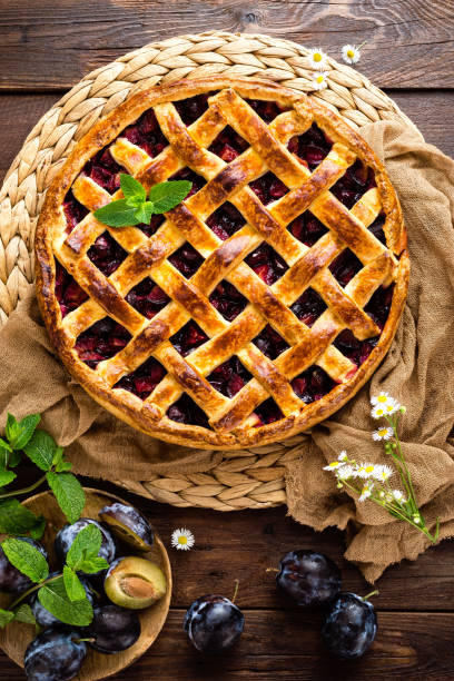 istock Fruit pie. Sweet pie, tart with fresh plums. Delicious cake with plums 1014995304