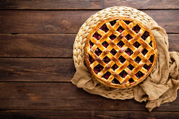 istock Fruit pie. Sweet pie, tart with fresh plums. Delicious cake with plums 1014995400