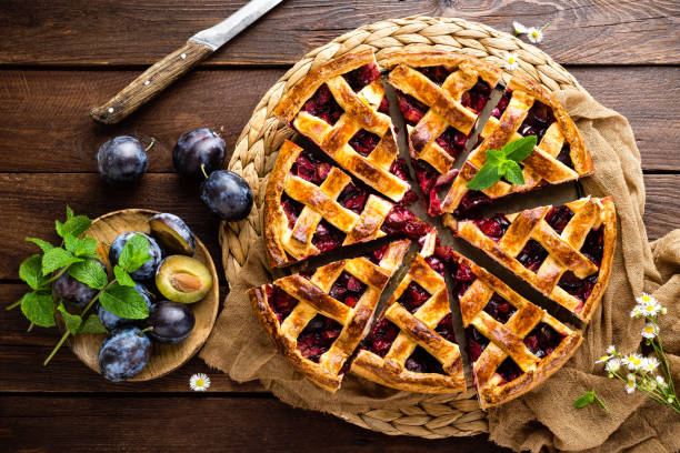 istock Fruit pie. Sweet pie, tart with fresh plums. Delicious cake with plums 1014995406
