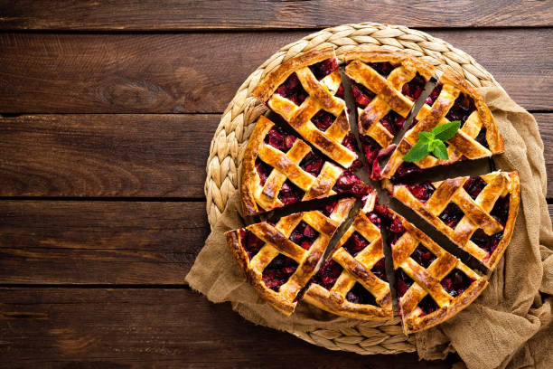 istock Fruit pie. Sweet pie, tart with fresh plums. Delicious cake with plums 1014995472