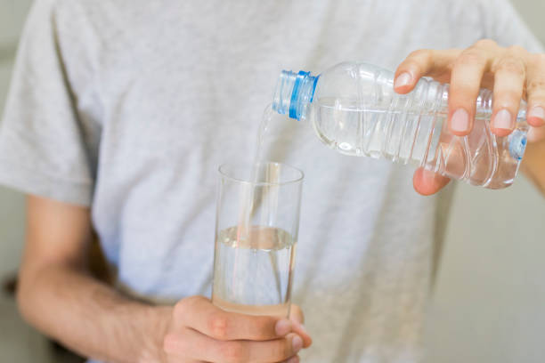 istock hands with a glass of water 1014996072