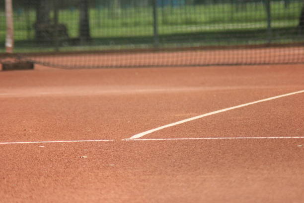 istock Tennis court with nets and posts 1014998682
