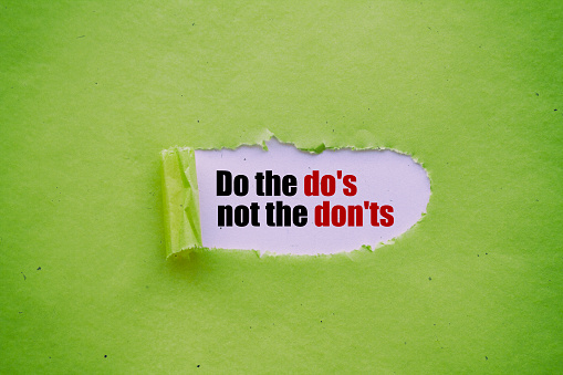 Do the do's not the don'ts written under torn paper.