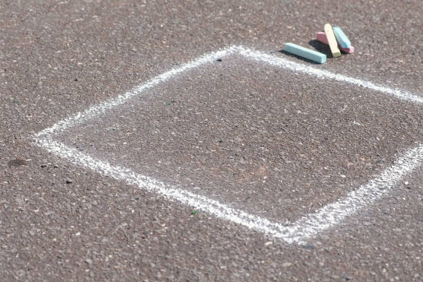 istock Drawing square with chalk on asphalt outdoor. 1015007216