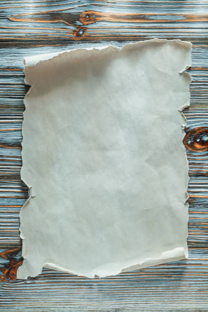 istock Vintage blank paper roll on blue wooden background 1015007564