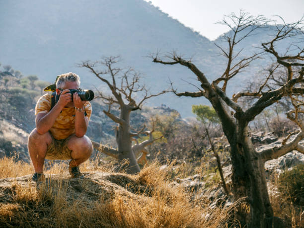 istock Man taking pictures in Africa 1015012682