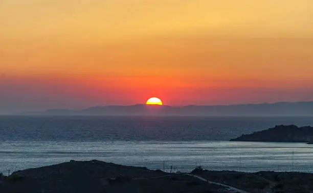 Finikas Bay in Syros Island at Sunset.