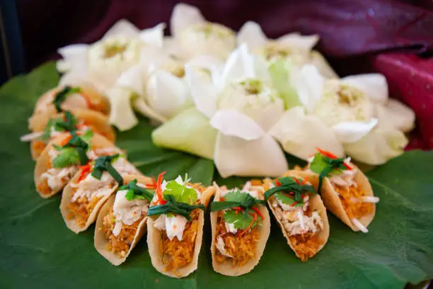 Thai style crab and coconut taco. Food Styling, creative plating and decorating presentation idea, arrangement for party canape, tapas, finger food, amuse bouche for Hors d'oeuvre and appetizer dish.